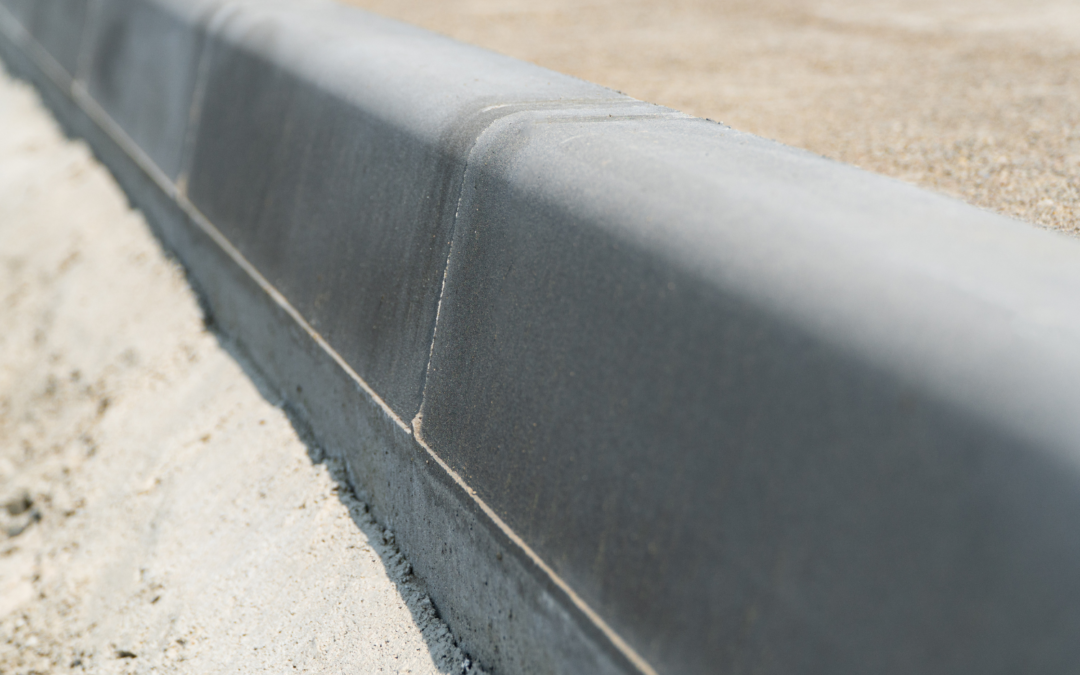 Well-designed concrete sidewalks and curbs in front of a business property.